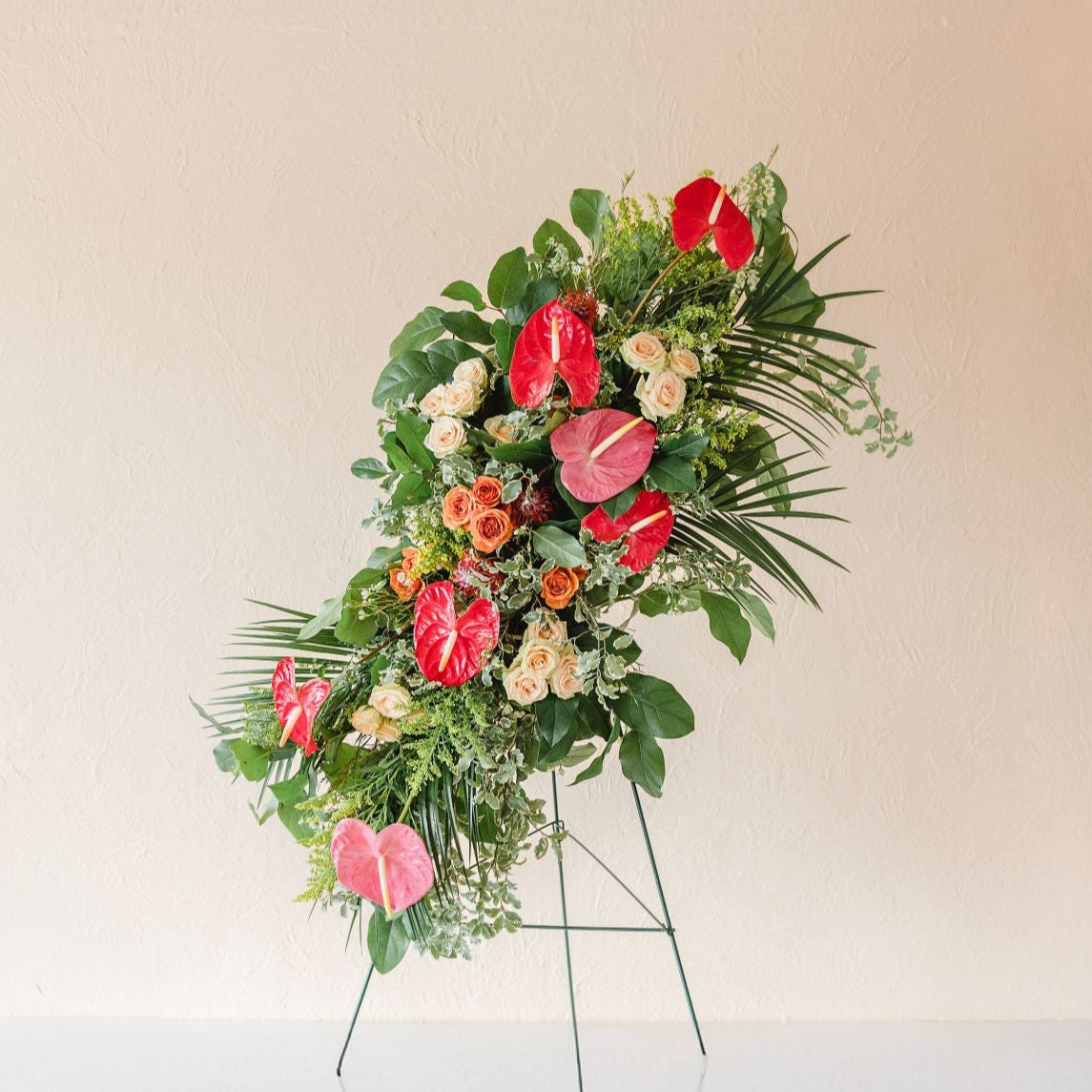 standing arrangement of flowers for funerals or memorial services