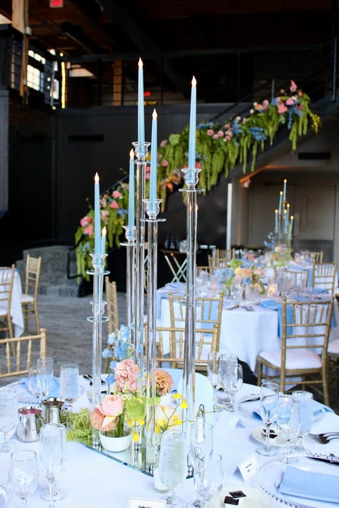 elegant taper candles complement bud vases for a special occasion