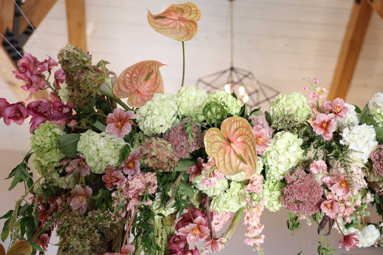 elegant installation piece with orchids, hydrangea, anthurium, tulips