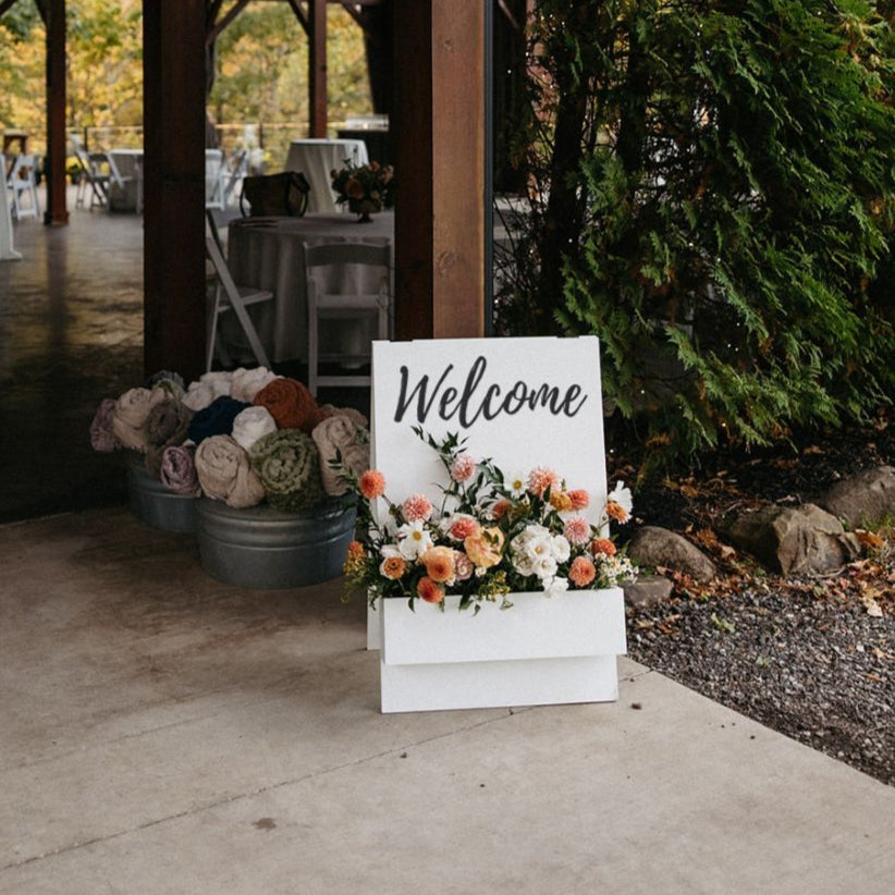 a beautiful way to welcome wedding guests with flowers