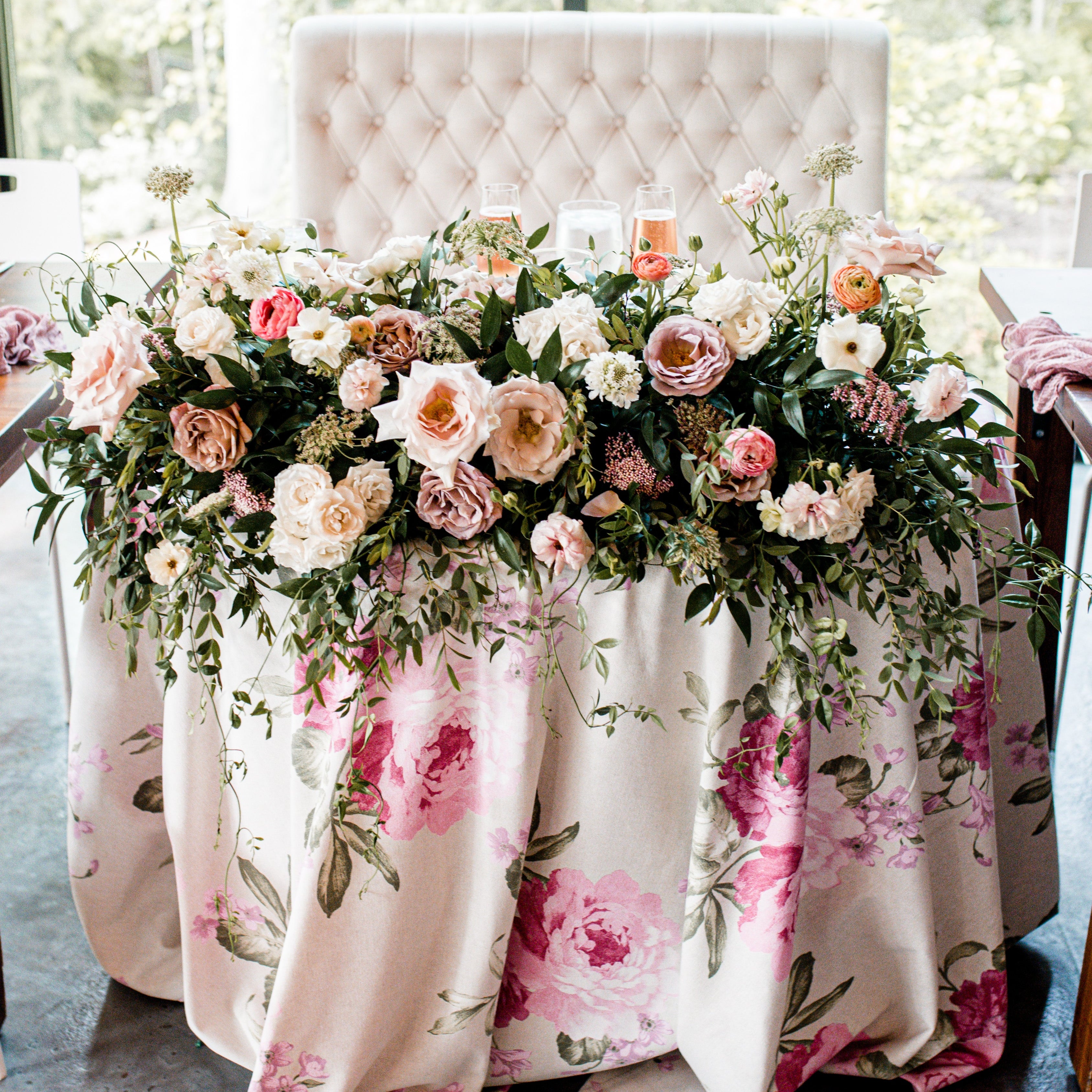 luxe flowers adorn a sweetheart wedding table at an elegant wedding