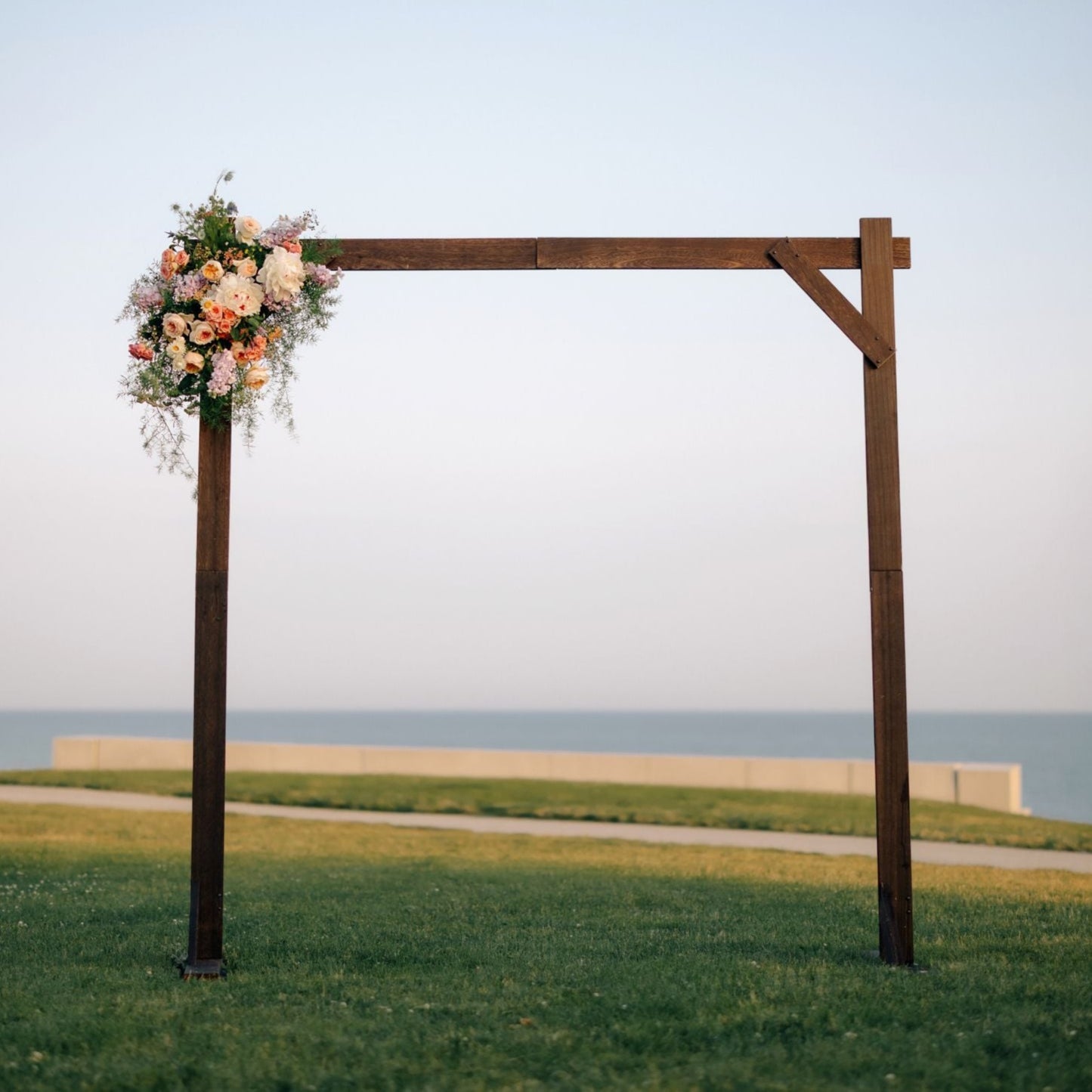 wooden arch accented with fresh flowers