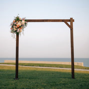 wooden arch accented with fresh flowers