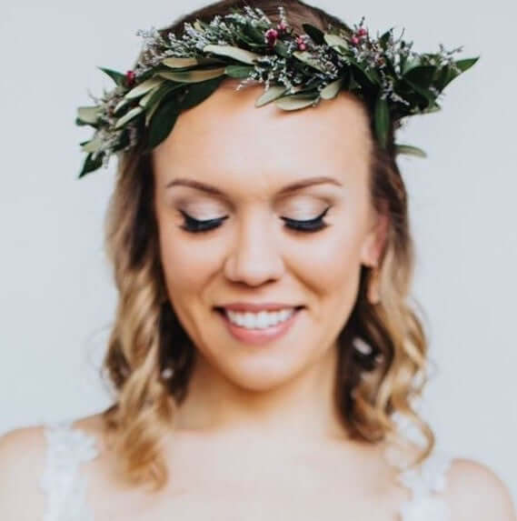 Woman wearing whimsical dainty flower crown