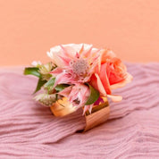 Designers use fresh roses and healthy blooms to create a classic and beautiful personal flowers for a wedding of any size