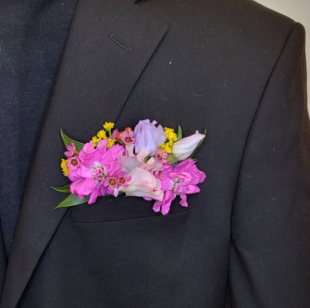Bright pocket florals are a modern and current piece for the groom, father of the bride, groomsmen