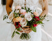 classic roses with mixed greens are gathered and tied to make an elegant bridal bouquet for Columbus brides