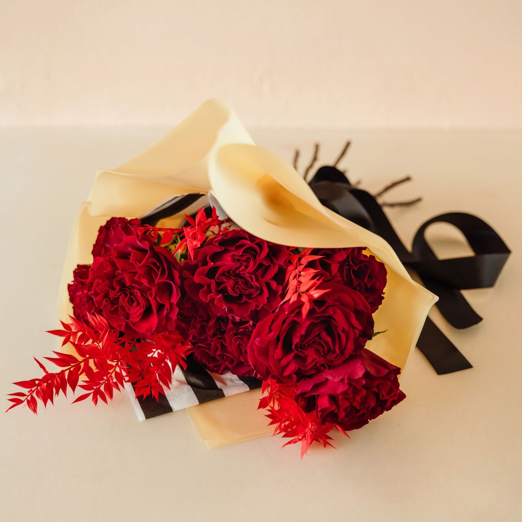 Blossom's take on red roses with black satin ribbon