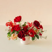 two different types of red roses in a beautiful Valentines arrangement
