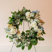 roses, spray roses, delphinium and vibrant greenery