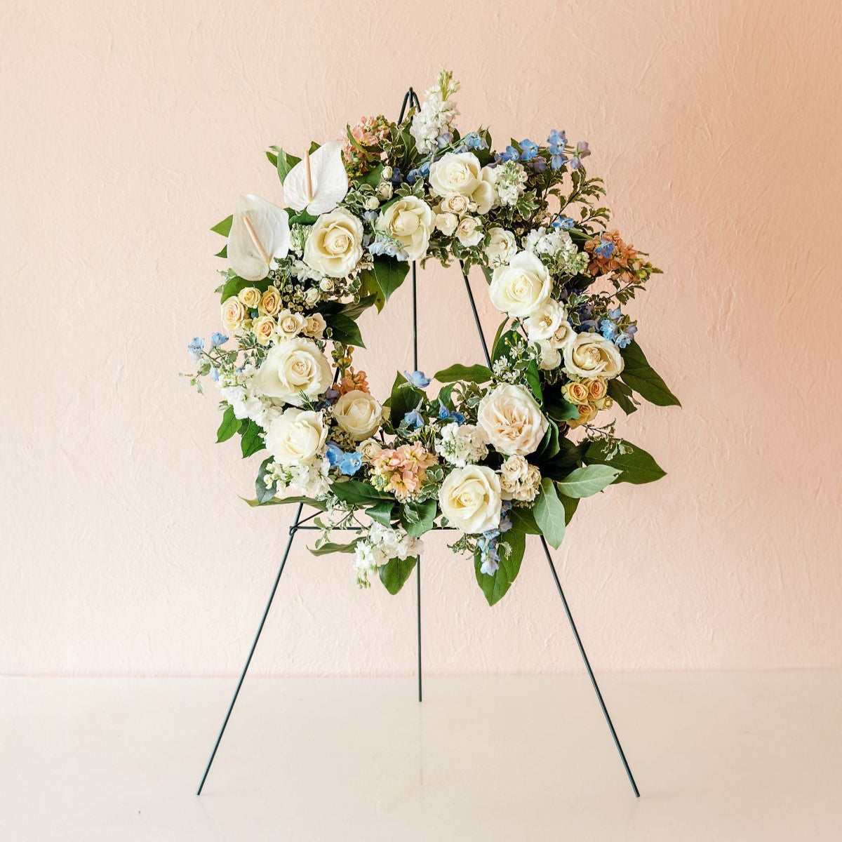 a memorial wreath standing on an easel