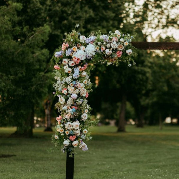 Flower arch details of roses, ranunculus, spray roses