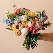 A beautiful hand-held bouquet of flowers fit for a bride