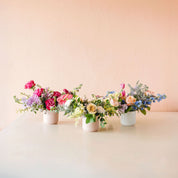 3 beautiful flower arrangements in vases