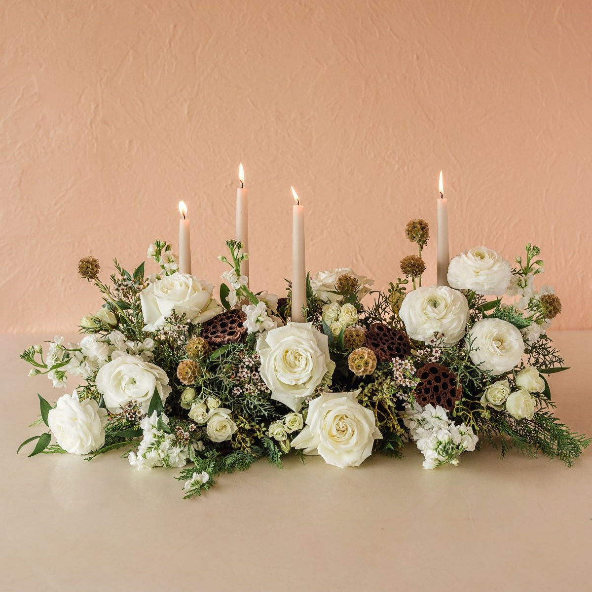roses, greens and candles for the holiday table