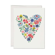 a heart shaped collection of flowers makes this card perfect for any occasion