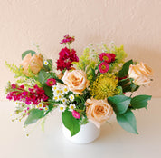 Vibrant fuschia stock and china aster with pale roses, solidago and pincushion protea make the perfect gift for delivery or pickup