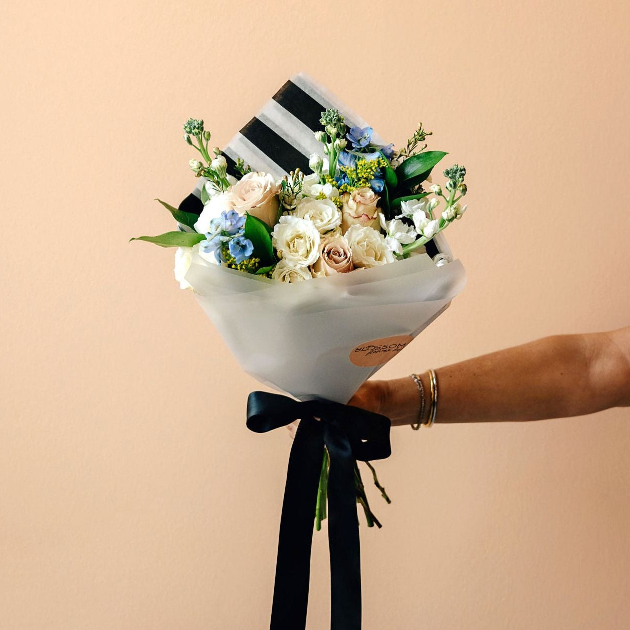 a wrap of flowers designed to be gifted and presented in public