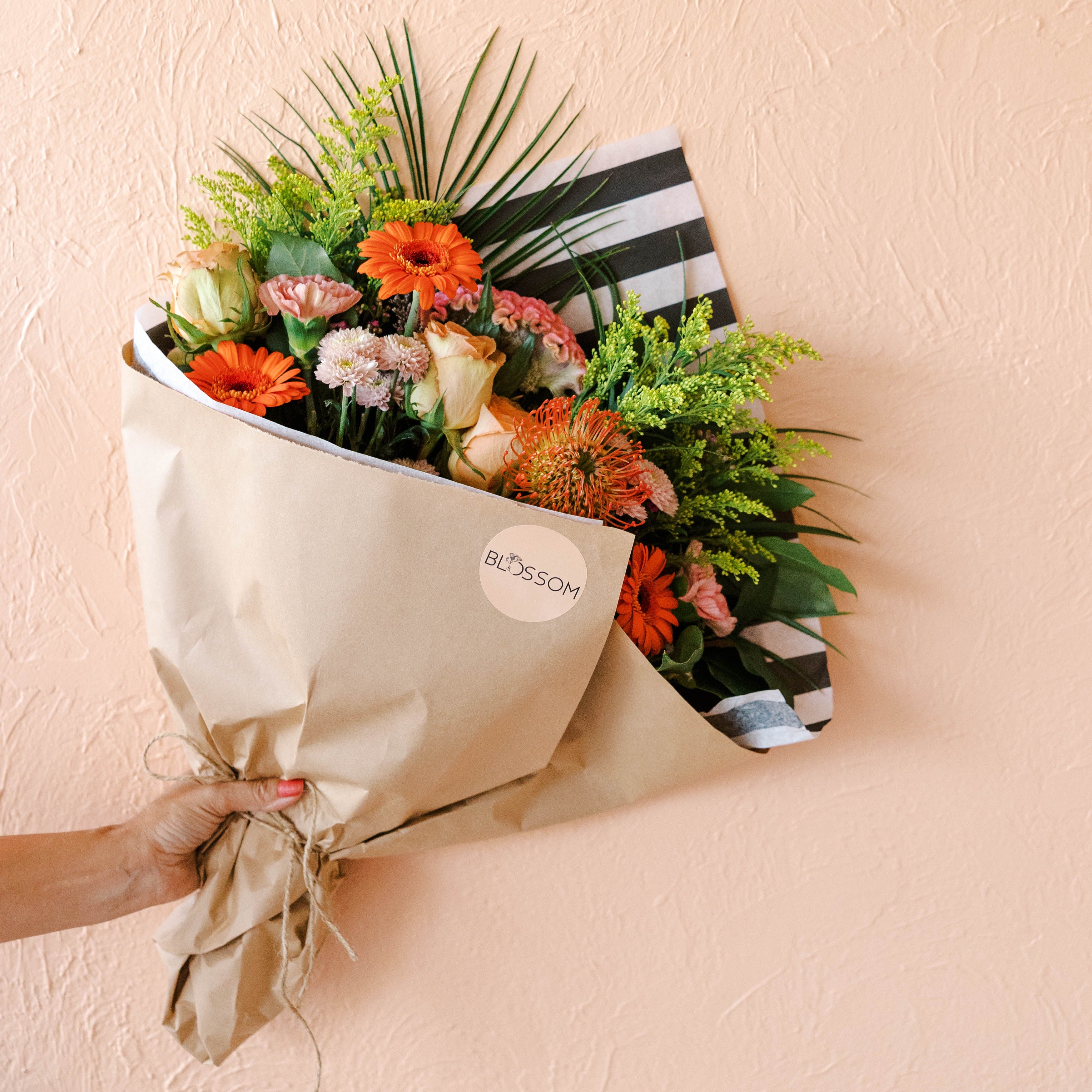 a fun and bright wrap with a palm leaf wrapped for delivery or store pickup