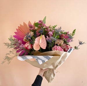 Large arrangement of healthy flower blooms and greenery